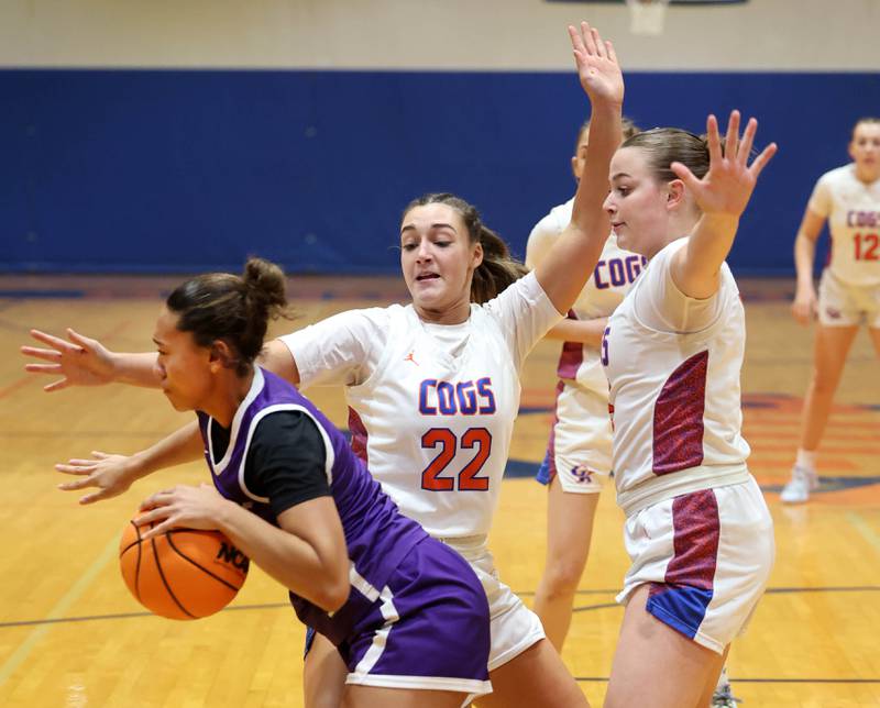 Genoa-Kingston's Regan Creadon (left) and teammate Zoe Boylen trap Rochelle's Carmela Bright during their game Monday, Dec. 16, 2024, at Genoa-Kingston High School.