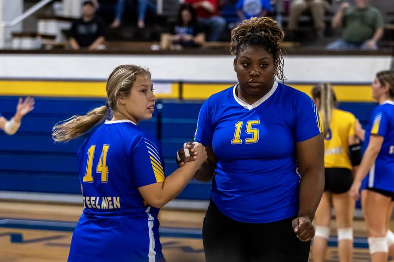 Joliet Central's Cameron Salazar and Makinsey Whitmore wait for the go ahead to make a substitution during a varsity volleyball home game against Lisle on Sept. 22, 2025.