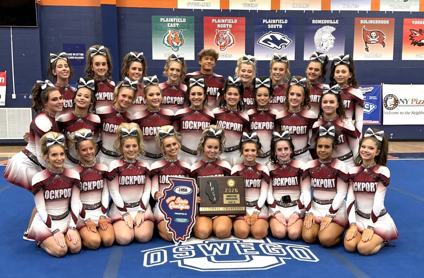 The Lockport competitive cheer team won the Class 3A Oswego Sectional championship and ultimately placed second at the IHSA State Finals last weekend in Bloomington. The team includes (listed from left to right): in front – Kenzie Moorhouse, Kayla Greenhill, Emma Smith, Morgan Ebert, Jordyn Lyerla, Mia Pasco, Keagan Brown, Genesis Arredondo and Emma Bagdonaite; middle row – Sophia Friscia, Leah Brutus, Sofia Janociak, Carly Fiorillo, Maggie Calabrese, Gianna Lavaty, Emma Brutus, Gaby Skiba and Adeline Mihalik; and in back – Mia Manzo, Lola Alex, Sophia Hutera, Jade Penzkofer, Jacob Hajnos, Kennedi Bensfield, Payton Judd, Nicole Magiera and Karina Juarez. Coaches are Jenny Mercado, Alex Mercado and Danielle Calabrese.