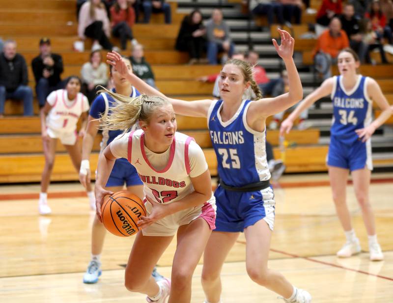 Batavia’s Ali Thomas gets around Wheaton North’s Brigitte Noyes during a game on Wednesday, Jan. 29, 2025 at Batavia.