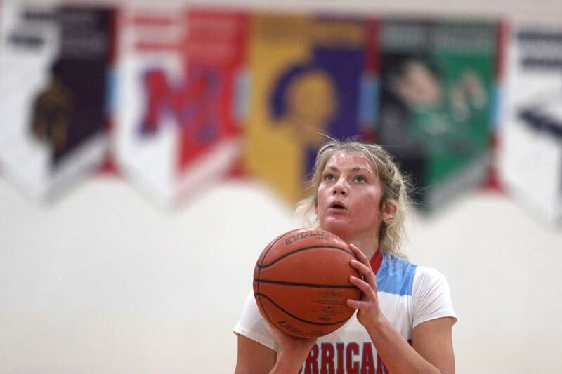Marian Central’s Madison Kenyon takes a free throw against Rockford Guilford’s Nadia Barbour in varsity girls basketball Saturday at Landers Pavilion on the campus of Marian Central High School in Woodstock.
