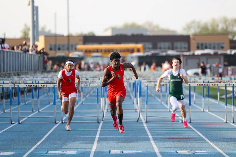 Bradley-Bourbonnais' Jamir Burt nears the finish line to claim first place in the boys 110-meter hurdles during the All-City meet at Kankakee High School on Monday, April, 28, 2025.