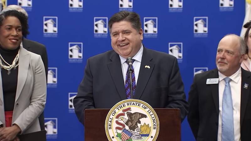 Gov. JB Pritzker speaks at a news conference in Normal Tuesday which he called to tout his proposed investments in higher education. (Credit: Illinois.gov)