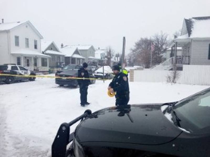 Joliet police officers at the corner of Garnsey Avenue and Ward Street near a house where a 4-year-old boy and a 36-year-old woman were shot to death Sunday, Jan. 25, 2026.
