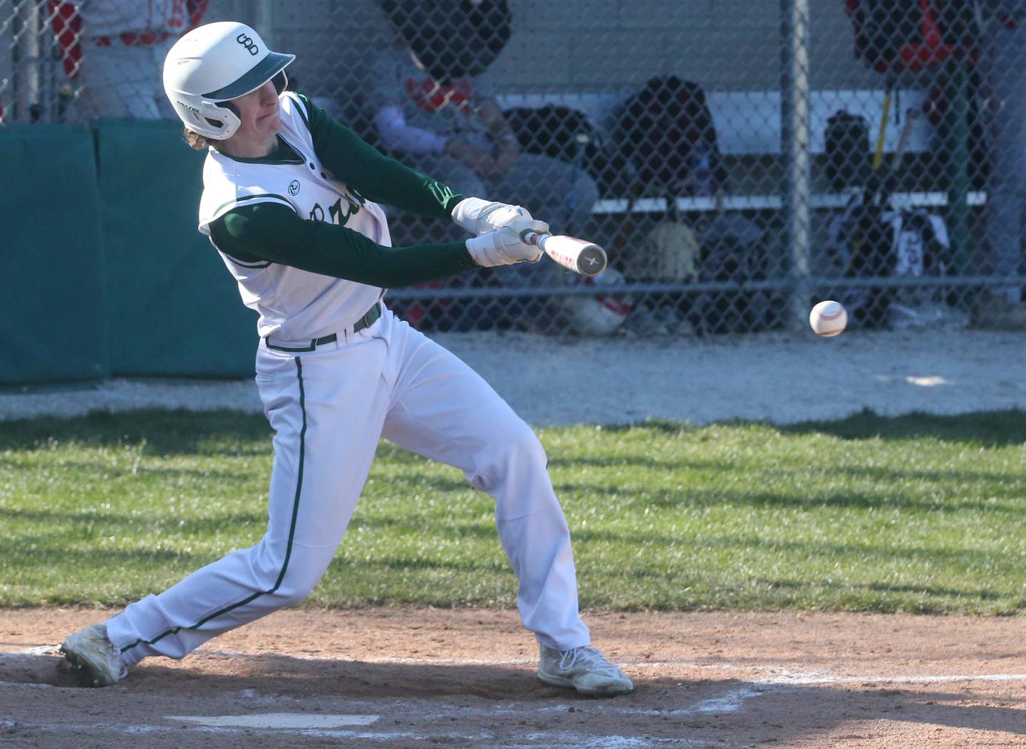 St. Bede's Gus Burr makes contact with the ball as he reaches first base on this hit against Ottawa on Wednesday, March 20, 2024 at St. Bede Academy.