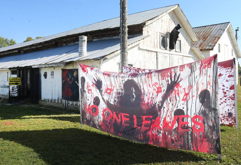 A sign reads "no one leaves" outside of the Nightmare on Fairgrounds Road Haunted Attraction on Monday, Sept. 29, 2025 in Princeton. This year’s event features: haunted barns, bonfire, and souvenirs. The popular haunted house is open Friday's and Saturday's from 7p.m.-10p.m. at the Bureau County Fairgrounds in Princeton. Admission is $20 for kids age 8 and older.