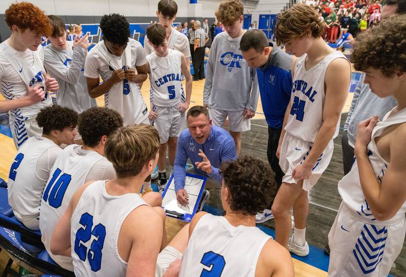Burlington coach Brett Porto talks to his team during a timeout at a game against Hampshire High School on Friday, Dec. 22, 2023.