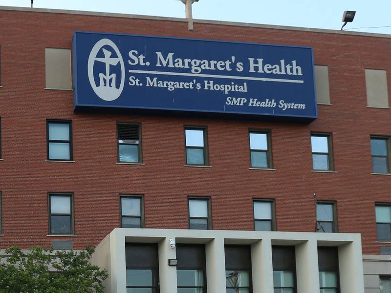 Pizzas lay on the hood of a car while St. Margaret's employees gather outside St. Margarets's Hospital for a gathering on Friday, June 16, 2023 in Spring Valley.