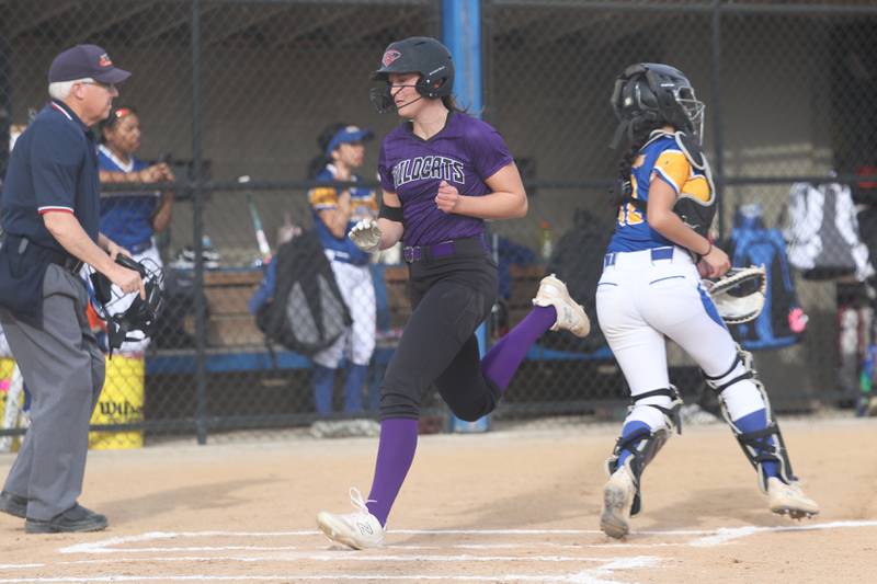 Wilmington’s Molly Southall crosses the plate for a 2-run inside the park home run against Joliet Central on Tuesday, March 12 in Joliet.
