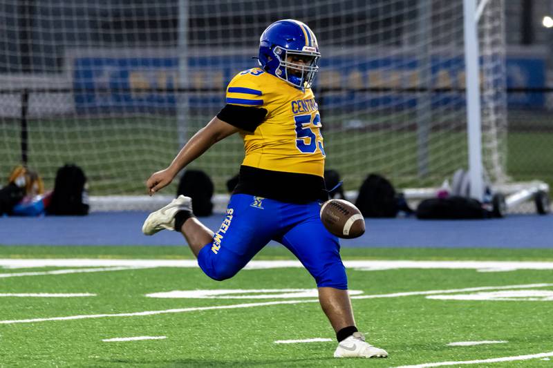 Joliet Central's Andres Leon punts during a varsity football home game against Plainfield Central on Sept. 26, 2025.