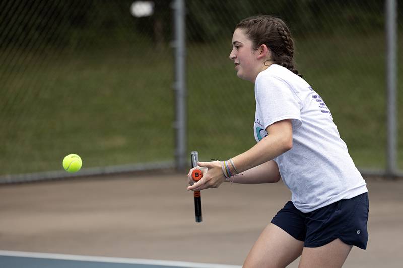 Jenna Mustapha returns a shot during a doubles match Thursday, July 27, 2023 at the Emma Hubbs Tennis Classic in Dixon.