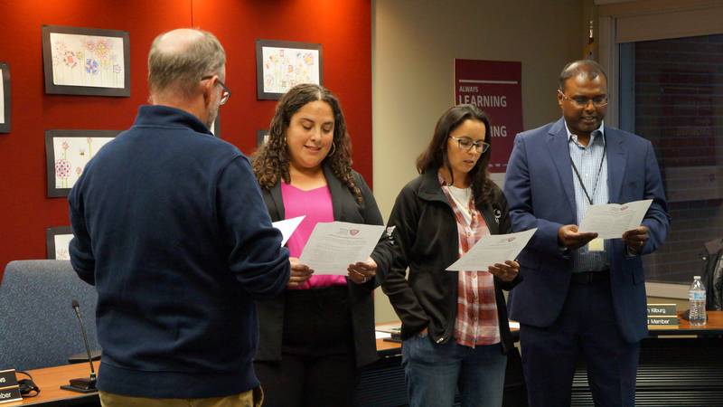 Batavia school board President Craig Meadows swears in three new Board of Education members Danielle Sligar, Raquel Gonzalez-Thomas and Rob Arulandu on April 25, 2023.