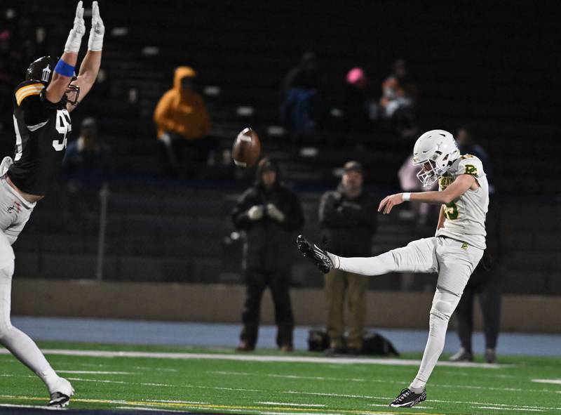 Providence Catholic's Bryce Vlasak (15) punts the ball during the conference game against Joliet Catholic on Friday, OCT. 24, 2025, at Joliet.