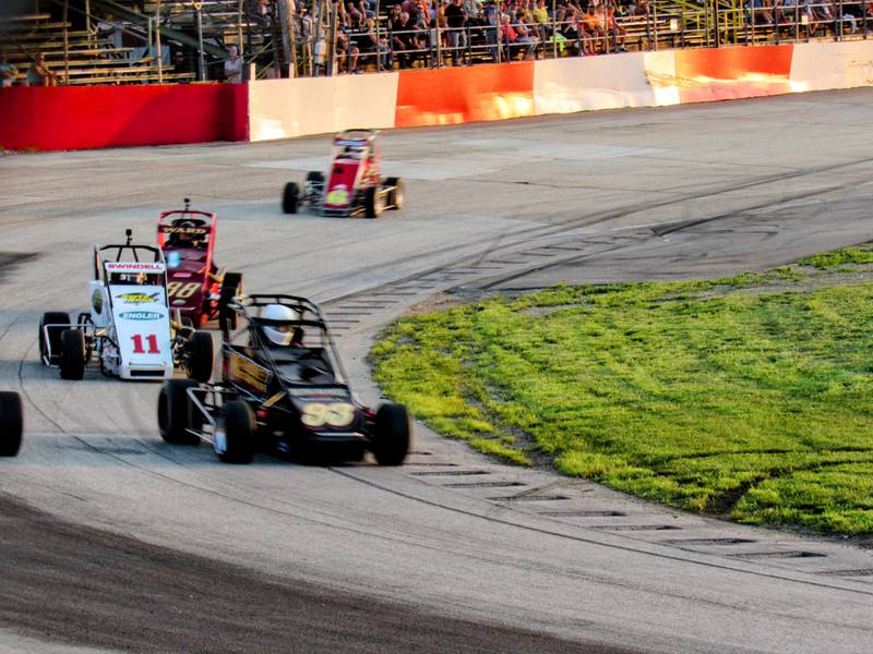 National Sprint Car Hall of Famer Sammy Swindell (#11) chases #93 Travis Mahoney.