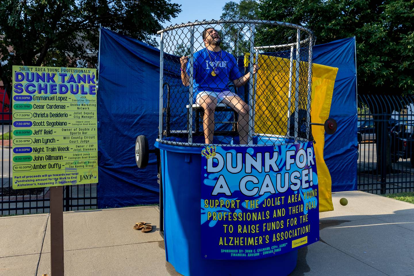 Emmanuel Lopez, Executive Director of Joliet City Center Partnership, braces for potential impact at the Dunk Tank during New Orleans North Festival at Joliet Slammers Stadium on Aug. 15, 2025.