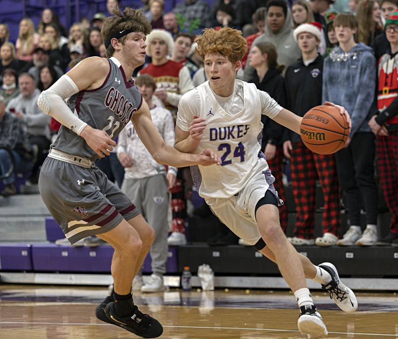 Dixon’s Austin Hicks drives the baseline against IVC’s Kai Morrow Tuesday, Dec. 20, 2022.