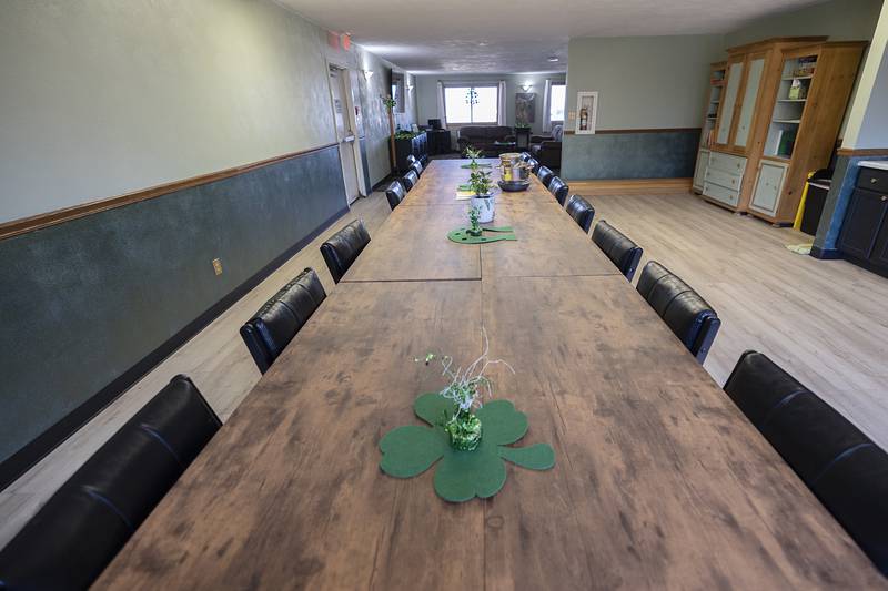 A table in Cledy’s communal kitchen is a great place for clients to share their experiences with one another.
