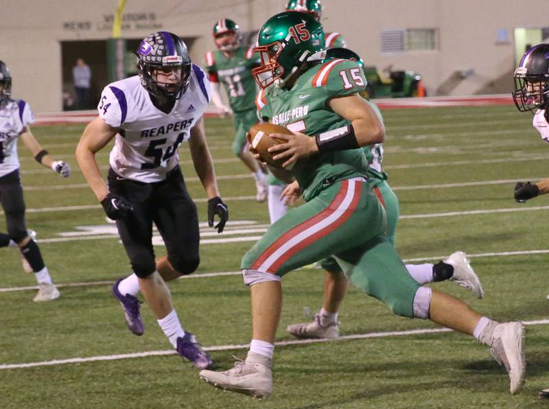 L-P quarterback Brendan Boudreau runs the football against Plano on Friday, Sept. 15, 2023 at Howard Fellows Stadium.