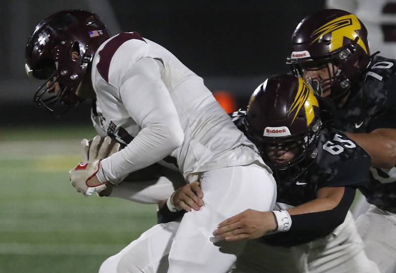 Marengo's Parker Mandelky is tackled by Richmond-Burton's Trevor Szumanski during a Kishwaukee River Conference football game on Friday, Oct. 17, 2025, at Richmond-Burton High School in Richmond.