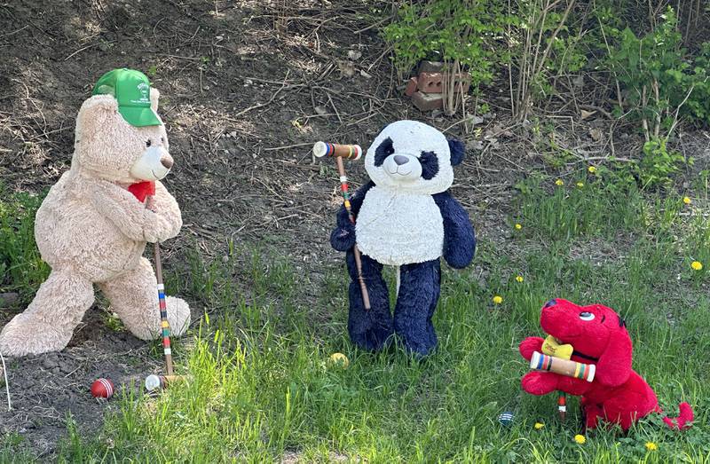 A cute teddy bear display changes seasonally in front of 849 North 2803rd Road on Sunday, May 7, 2023 in Utica.