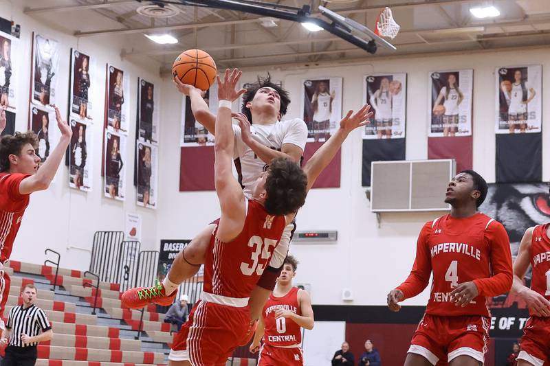 Plainfield North’s Lukas Alvarez draws the shooting foul against Naperville Central on Wednesday, Jan 22, 2025 in Plainfield.