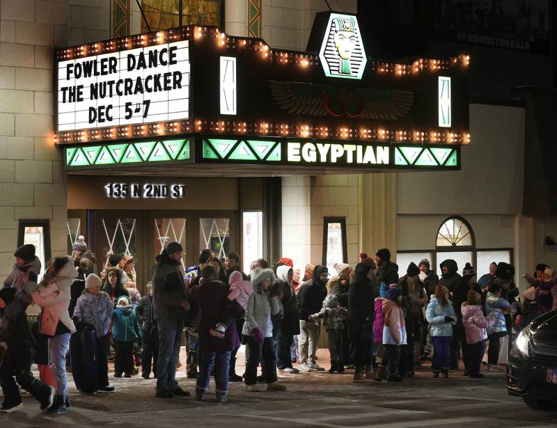 Attendees wait in front of the Egyptian Theatre for Santa Claus Thursday, Dec. 4, 2025, during the annual Lights on Lincoln and Santa Comes to Town event hosted by the DeKalb Chamber of Commerce.