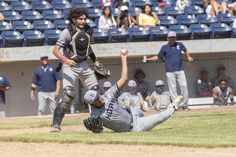Chicago Hope’s Cesar Marquez falls as he throws a from the ground on a bunt play against Newman Monday, May 29, 2023.