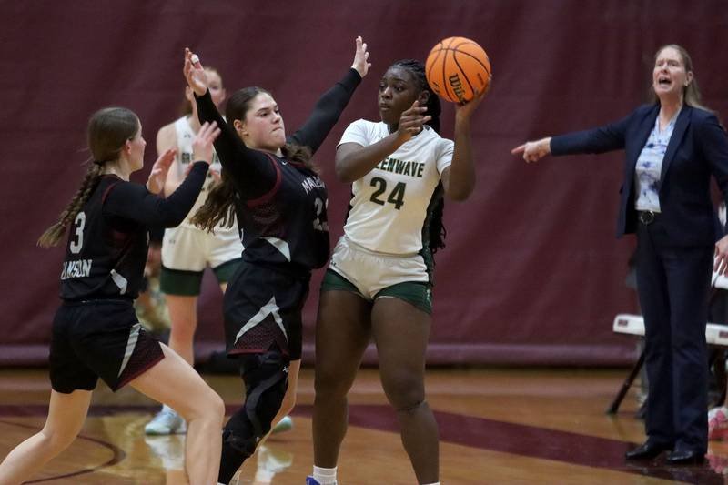 St. Edwards’ Sanaii McPherson looks for an option past Marengo’s Gianna Iovinelli and Maggie Hanson in IHSA Regional Championship girls basketball on Thursday, Feb. 19, 2026, at Marengo High School in Marengo.