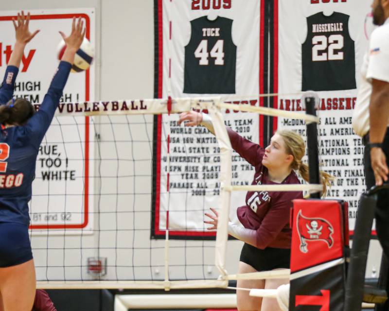 Lockport's Quinn Higham (16) spikes the ball during Class 4A Bolingbrook Sectional final match between Lockport at Oswego.  Nov 7, 2024  in Bolingbrook.