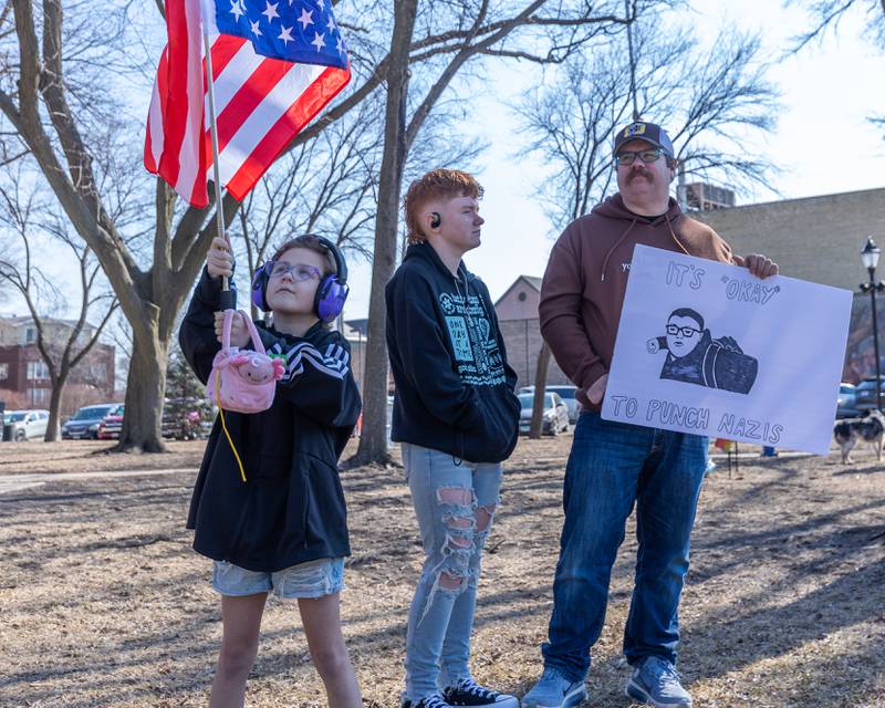 Child waves U.S flag at the 'Pretti good time for a Protest' on Feb. 15, 2026 at Washington Square Park in Ottawa.