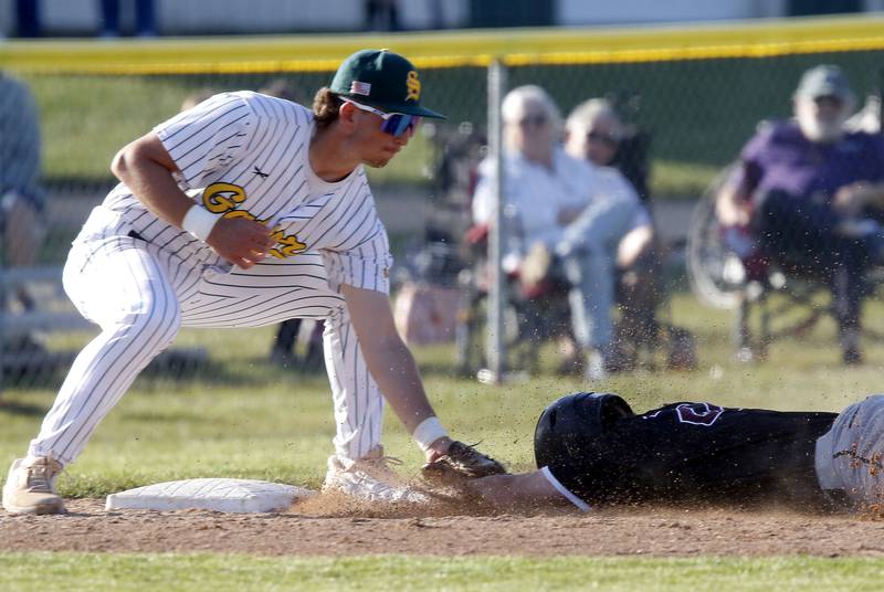 Crystal Lake South's Michael Silvius tags out Prairie Ridge's Gavin Piekos as Piekos tries teach a three-run double into a triple during a Fox Valley Conference baseball game on Friday, May 15, 2026, at Crystal Lake South High School.