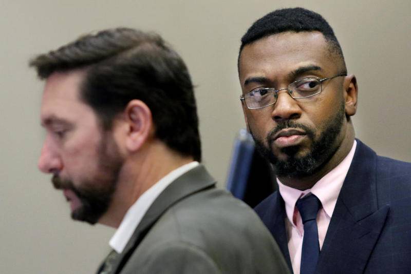 Corey Butler (right) Pastor at Jesus Is The Way Christian Center in DeKalb, prepares to leave Judge Robbin Stuckert's courtroom with attorney Bob Motta of Aurora on Nov. 1, 2017, at the DeKalb County Courthouse Sycamore.