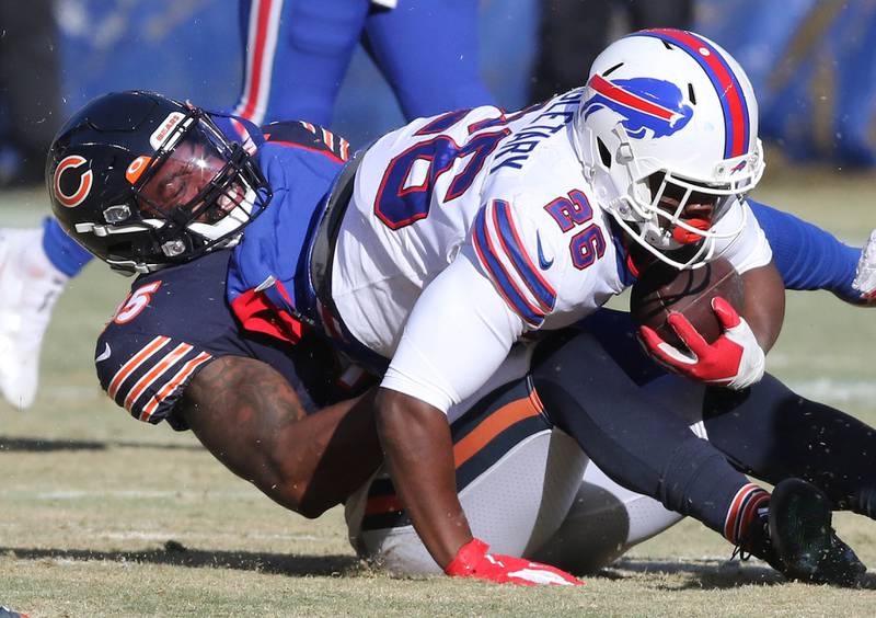 Chicago Bears linebacker Joe Thomas brings down Buffalo Bills running back Devin Singletary during their game Sunday, Dec. 24, 2022, at Soldier Field in Chicago.