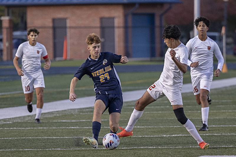 Sterling’s Liam Gardner passes the ball against Lasalle-Peru’s Antonio Martinez Tuesday, Oct. 17, 2023 in a regional semifinal in Sterling.