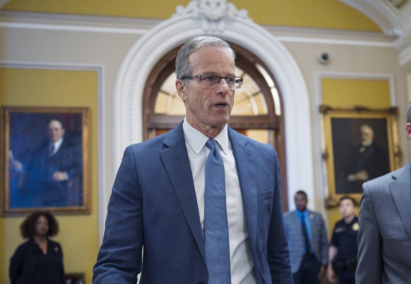 Senate Majority Leader John Thune, R-S.D., rushes from the chamber to his office as he struggles with Republicans opposed to President Donald Trump's signature bill of big tax breaks and spending cuts, at the Capitol in Washington, Tuesday, July 1, 2025. (AP Photo/J. Scott Applewhite)