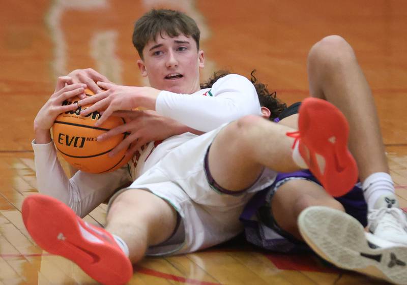 L-P's John Sowers falls to the hardwood on a loose ball against Dixon during the Class 3A Regional semifinal game on Wednesday, Feb. 25, 2026 in Sellett Gymnasium at L-P High School.