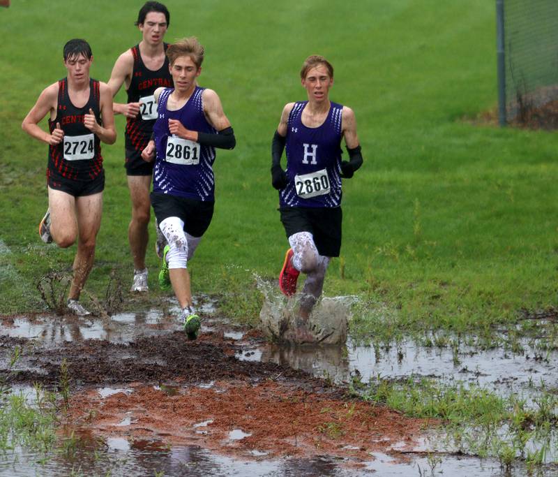 Runners compete during the Fox Valley Conference Boys Cross Country Meet at Plato Park in Elgin Saturday.