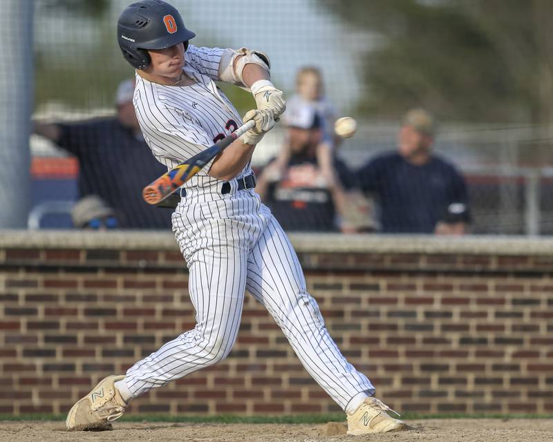 Oswego's Conor Tully (23) swings at a pitch during baseball game between Plainfield North at Oswego, Thursday, April 24, 2025 in Oswego.