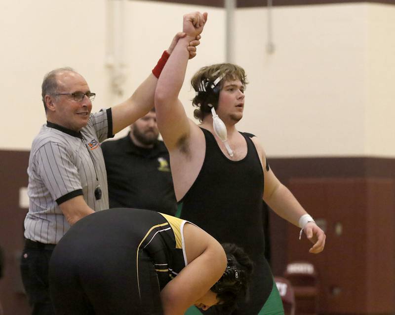 Aldren-Hebron’s Jesse Ambrust has his hand raised after he pinned Harvard’s Yair Morales their 285-pound third place wrestling match in the IHSA 1A Richmond-Burton Wrestling Regional Thursday, Jan. 19, 2023, at Richmond-Burton High School in Richmond.