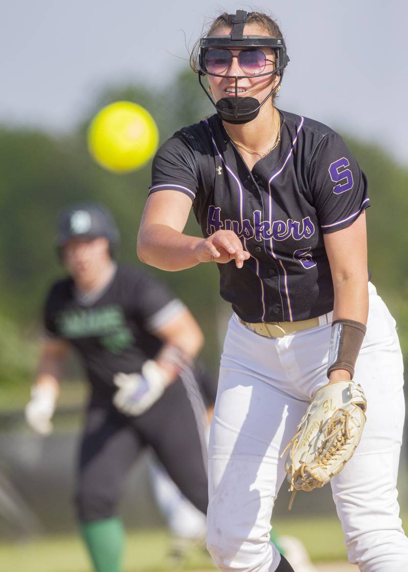 Serena's Maddie Glade throws a pitch with a Dwight High School player in scoring position during the Class 1A Sectional semifinal game at Woodland High School on May 21, 2024.
