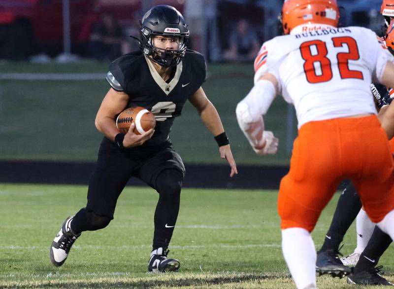 Sycamore's Griffin Larsen looks to get by Mahomet-Seymour's Paxson O’malley during their game Friday, Sept. 12, 2025, at Sycamore High School.