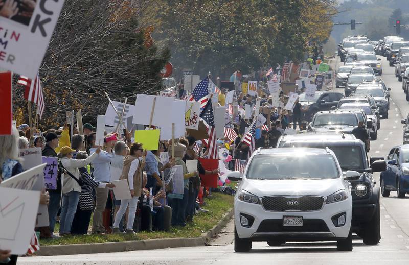 Protesters line Route 31 during a "No Kings” protest rally on Saturday, Oct. 18, 2025, in McHenry. The protest drew thousands of protesters to the area to protest the policies of President Donald Trump.
