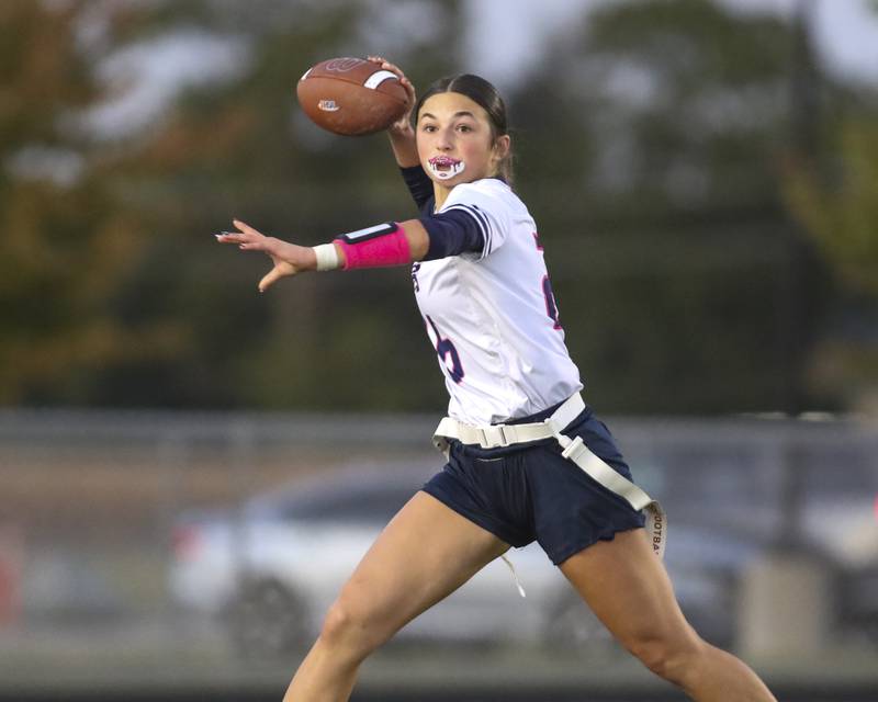 Oswego East's Danielle Stone (26) passes during Oswego East Regional Final flag football game between St. Charles North at Oswego East Thursday, Oct 9, 2025 in Oswego.
