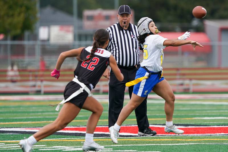Joliet Central's Victoria Godinez (15) throws a pass against Yorkville during a flag football game at Yorkville High School on Monday, Sep 23, 2024.