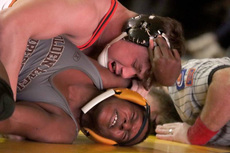 Jacobs’ Bonny Nuwasiima, bottom, battles Crystal Lake Central’s Cayden Parks at 190 pounds in varsity wrestling on Thursday, Jan. 16, 2025, at Jacobs High School in Algonquin.