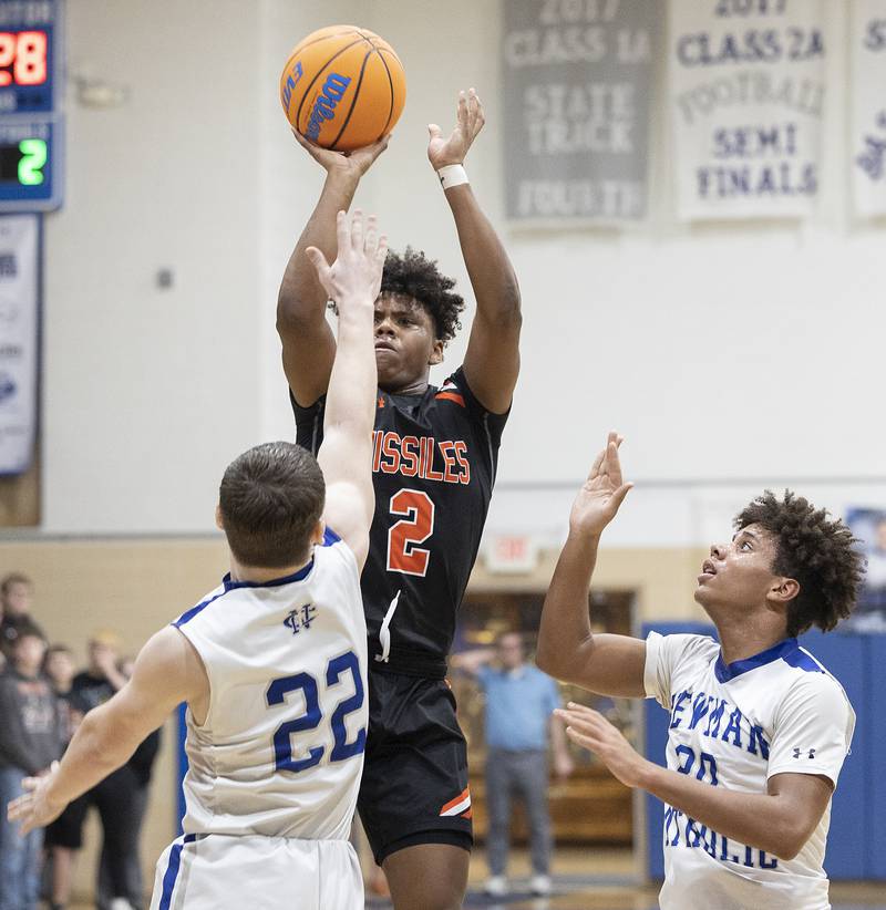 Milledgeville’s Micah Toms-Smith puts up a shot against Newman’s Ashton Miner Monday, Feb. 24, 2025, during a Class 1A Regional quarterfinal at Newman High School.