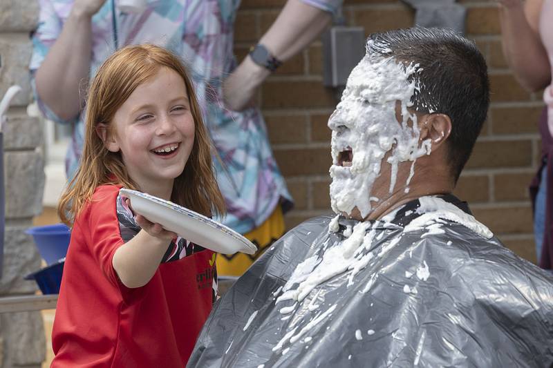 Second grader Lola Smith delivered the final pie to Steve Caudillo's face on Friday, May 5, 2023 at St. Anne School in Dixon.