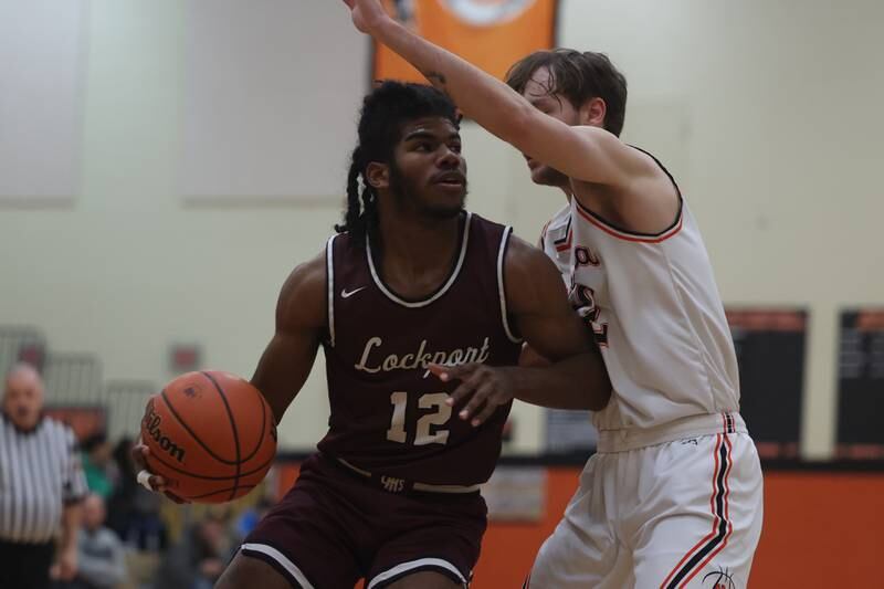 Lockport’s Jalen Falcon works his way to the basket against Minooka.
