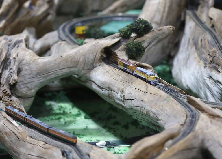 A z-gauge model train built into a piece of driftwood on Saturday, Jan. 21, 2023, at the Illinois Railway Museum. The museum is celebrating its 70 anniversary with the first of many celebrations by commemorating the 60 years since the abandonment of the Chicago North Shore and Milwaukee Railroad.