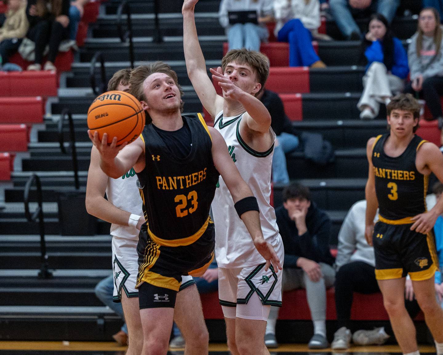 Branden Bickerman (23) of Putnam County maneuvers for layup during the Colmone Classic on Monday, December 8, 2025 at Hall High School in Spring Valley.